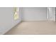 Bright bedroom with carpet, a door, window and base molding at 7370 Michelle Rd, Rocky Mount, NC 27803
