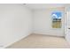 Bedroom featuring neutral carpet, window, and baseboard at 7370 Michelle Rd, Rocky Mount, NC 27803