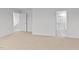 Spacious carpeted bedroom with adjoining bathroom and access to other rooms at 7370 Michelle Rd, Rocky Mount, NC 27803