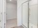 Bright bathroom showcasing a glass shower and walk-in closet for storage and convenience at 7384 Michelle Rd, Rocky Mount, NC 27803