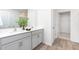 Modern bathroom featuring double sinks, granite countertops, and stylish gray cabinetry at 7384 Michelle Rd, Rocky Mount, NC 27803