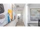 Hallway view with modern artwork and seamless transition to the dining area at 7384 Michelle Rd, Rocky Mount, NC 27803