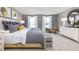 Relaxing primary bedroom featuring plush carpet, stylish bed, and bright windows with nice trim at 7384 Michelle Rd, Rocky Mount, NC 27803