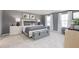 Serene primary bedroom with plush carpet, stylish bed, and an abundance of natural light at 7384 Michelle Rd, Rocky Mount, NC 27803