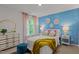 Bright bedroom with statement wallpaper and stylish gold-tone furniture at 7400 Michelle Rd, Rocky Mount, NC 27803