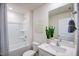 Clean bathroom with a shower-tub combination, sleek vanity, and neutral design elements at 7407 Michelle Rd, Rocky Mount, NC 27803