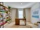 Bright office space with a desk, shelving, and natural light coming from the window at 7407 Michelle Rd, Rocky Mount, NC 27803