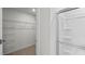 Bathroom with closet and glass-enclosed shower featuring convenient built-in shelves at 7416 Michelle Rd, Rocky Mount, NC 27803