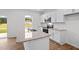 Modern kitchen with granite counters, white cabinetry and stainless steel appliances at 7416 Michelle Rd, Rocky Mount, NC 27803