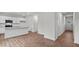 Bright open-concept living space featuring wood floors, recessed lighting, and a modern kitchen at 7416 Michelle Rd, Rocky Mount, NC 27803