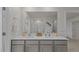 Modern bathroom featuring double sinks, a large mirror, and a glass-enclosed shower at 7434 Michelle Rd, Rocky Mount, NC 27803