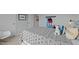 Comfortable bedroom features a plush patterned gray comforter and gray walls at 7434 Michelle Rd, Rocky Mount, NC 27803