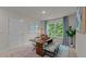 Dining room featuring a table with benches, a patterned rug, and a large window with natural light at 7434 Michelle Rd, Rocky Mount, NC 27803