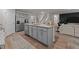 Spacious kitchen with stainless steel appliances, granite countertops, a center island, and ample cabinet space at 7434 Michelle Rd, Rocky Mount, NC 27803