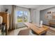 Bright and airy home office with a large window, wooden desk, and neutral decor at 7434 Michelle Rd, Rocky Mount, NC 27803