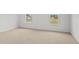 Neutral bedroom with carpeted floor, bright walls, and two large windows providing natural light at 7439 Michelle Rd, Rocky Mount, NC 27803