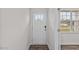 Bright entryway with a glass-paneled front door and wood-look floors at 7439 Michelle Rd, Rocky Mount, NC 27803