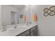 Bright bathroom featuring a double sink vanity, a large mirror, and modern fixtures at 7475 Michelle Rd, Rocky Mount, NC 27803
