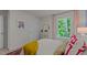 Bedroom featuring a large window offering a lush green view at 7475 Michelle Rd, Rocky Mount, NC 27803