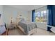 Charming bedroom with a cozy bed, a large window, and a view of the neighborhood at 7475 Michelle Rd, Rocky Mount, NC 27803