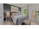 Inviting bedroom featuring stylish decor, a beach-themed art piece, and ample natural light at 7475 Michelle Rd, Rocky Mount, NC 27803