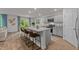 Open kitchen with gray cabinets, granite countertops, and a center island with seating at 7475 Michelle Rd, Rocky Mount, NC 27803