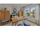 Bright office space with a large window, wooden desk, and comfortable seating at 7475 Michelle Rd, Rocky Mount, NC 27803