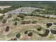 Aerial view of a community showcasing a golf course and beautiful, serene, landscape at 751 Parc Townes Dr # 32, Wendell, NC 27591