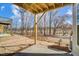 Covered patio overlooking a wooded backyard with mature trees in the distance at 751 Parc Townes Dr # 32, Wendell, NC 27591