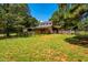 Exterior view of barn with fencing and well-maintained green grass at 815 Solitude Pt, Chapel Hill, NC 27516