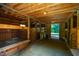 Barn interior showing open space, stalls, wood beams, and natural light streaming through the open doorway at 815 Solitude Pt, Chapel Hill, NC 27516