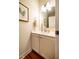 Bathroom featuring a vanity with white countertop and cabinetry, a mirror, and neutral walls at 815 Solitude Pt, Chapel Hill, NC 27516
