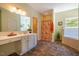 Bathroom featuring a double vanity, shower/tub combination, and tile floors at 815 Solitude Pt, Chapel Hill, NC 27516