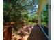 Wooden deck showcasing natural light and overlooking lush greenery, perfect for outdoor relaxation and enjoyment at 815 Solitude Pt, Chapel Hill, NC 27516