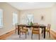 A formal dining room with hardwood floors, lots of natural light and a traditional-style dining table set at 815 Solitude Pt, Chapel Hill, NC 27516