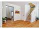 Inviting foyer with hardwood floors, staircase, and view into adjacent rooms at 815 Solitude Pt, Chapel Hill, NC 27516