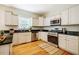 Updated kitchen features granite countertops, stainless steel appliances, and ample cabinet space at 815 Solitude Pt, Chapel Hill, NC 27516