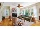 Bright and inviting living room featuring a cozy fireplace, lots of natural light, and hardwood flooring at 815 Solitude Pt, Chapel Hill, NC 27516