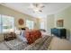 Spacious main bedroom with large windows, ceiling fan, and stylish rug at 815 Solitude Pt, Chapel Hill, NC 27516