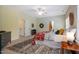 Bedroom featuring a queen bed, stylish rug, a ceiling fan and two doors at 815 Solitude Pt, Chapel Hill, NC 27516