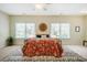 Bright main bedroom featuring a large window, stylish rug, and cozy decor at 815 Solitude Pt, Chapel Hill, NC 27516