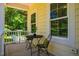 Cozy porch featuring a table and chairs, perfect for enjoying the tranquil outdoor scenery at 815 Solitude Pt, Chapel Hill, NC 27516