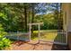 Well-kept yard with a white picket fence and arbor, providing a welcoming entrance and private space at 815 Solitude Pt, Chapel Hill, NC 27516