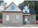 New construction home featuring a brick facade, black roof, and bright windows awaiting finishing touches at 824 Emmett Ct, Spring Hope, NC 27882