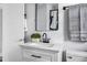 Bathroom featuring modern fixtures, a marble-top vanity and a patterned shower curtain at 829 Burton St, Rocky Mount, NC 27803