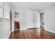 Hardwood bedroom featuring an ensuite bathroom and a closet at 829 Burton St, Rocky Mount, NC 27803