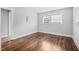 Sunlit bedroom with hardwood floors, neutral paint, and windows that provide ample natural light at 829 Burton St, Rocky Mount, NC 27803