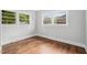 Bright bedroom with hardwood floors, natural lighting, and neutral walls at 829 Burton St, Rocky Mount, NC 27803