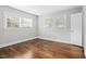 Spacious bedroom featuring hardwood floors, plenty of light, and neutral walls at 829 Burton St, Rocky Mount, NC 27803