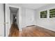 Well-lit bedroom with hardwood floors, a closet, and a window at 829 Burton St, Rocky Mount, NC 27803